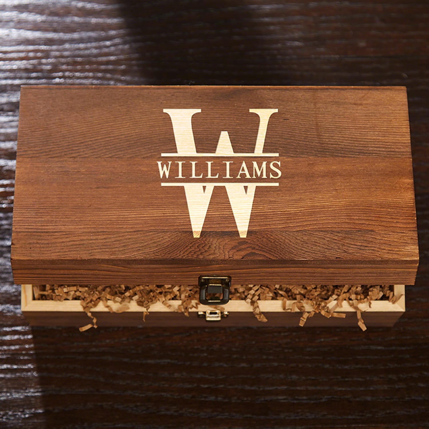 Wooden box with “WILLIAMS” and large W logo on lid, partly open with crinkle paper inside.