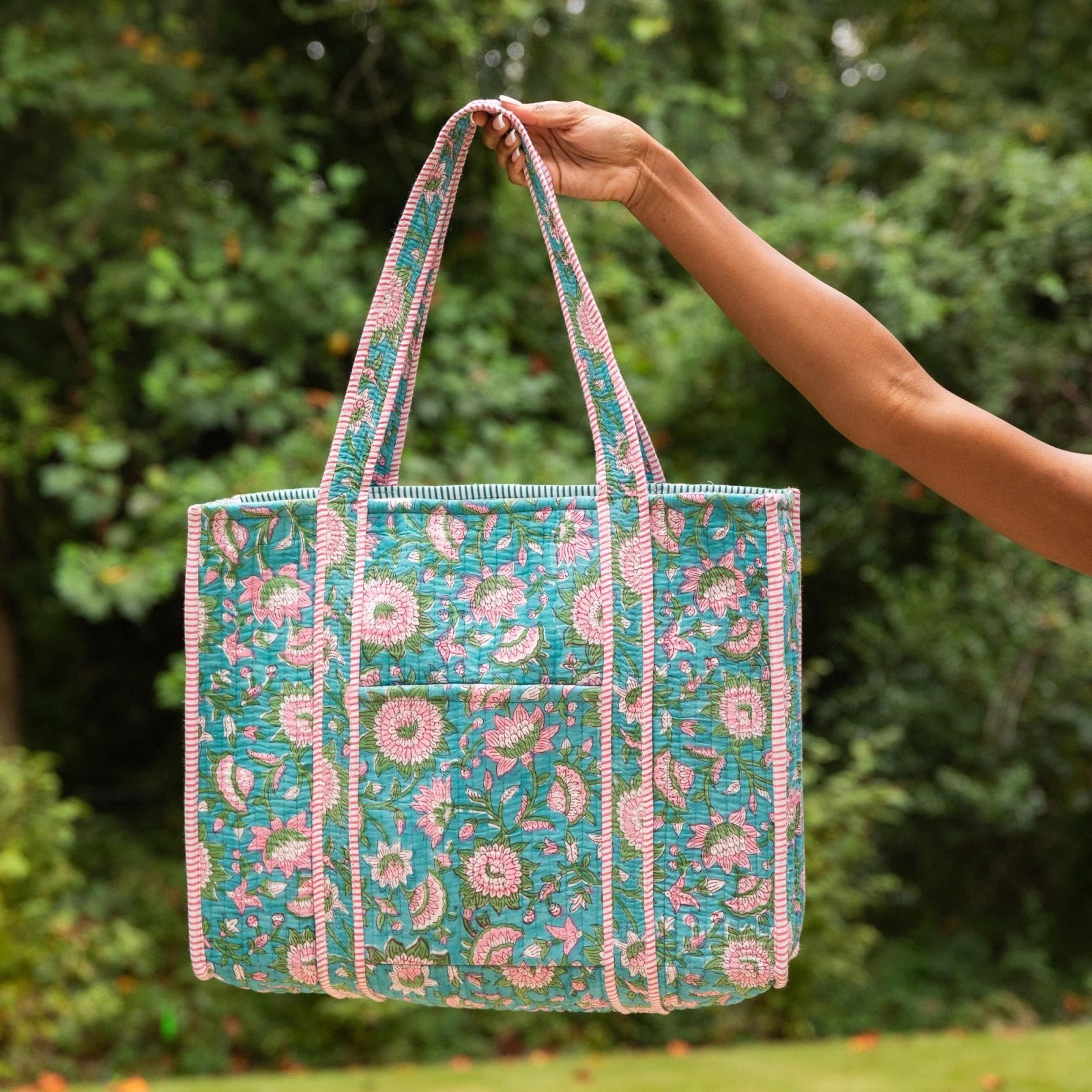Caelune Quilted Tote Carryall Bag for Women showing details in an outdoor setting