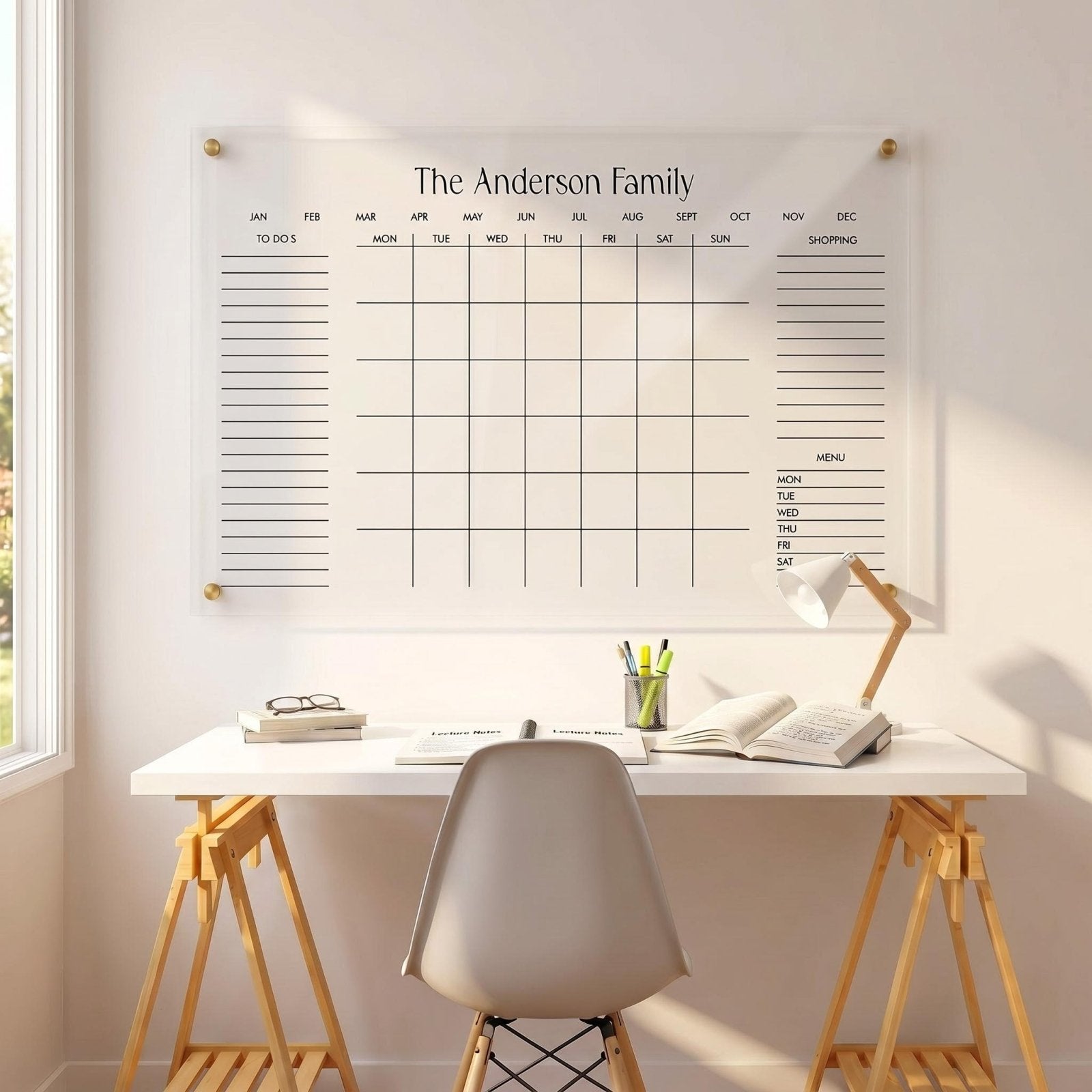 Personalized acrylic family wall calendar displayed above an office desk