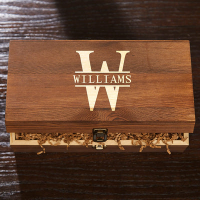 Wooden box with “WILLIAMS” and large W logo on lid, partly open with crinkle paper inside.