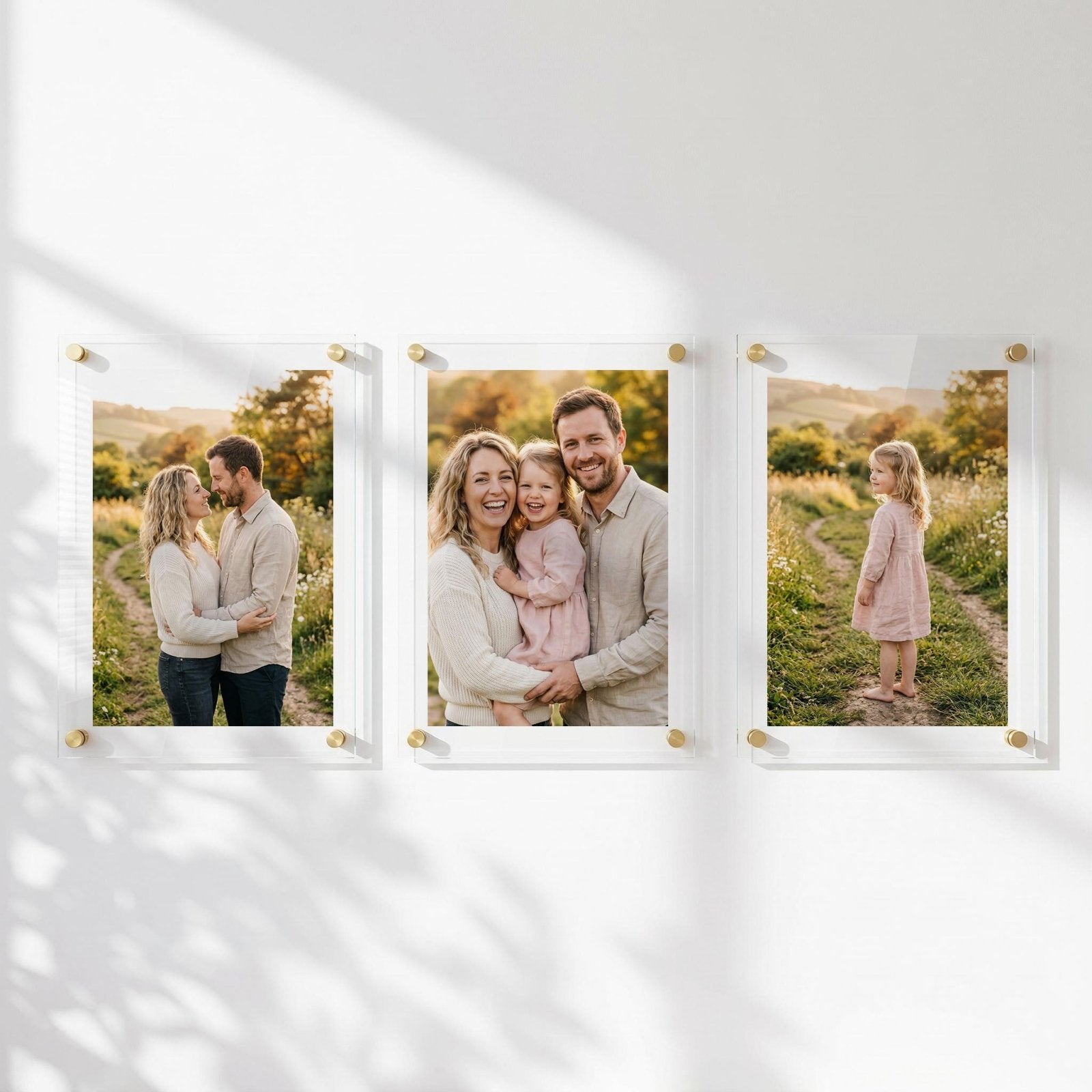 Three acrylic photo prints showing family portraits 