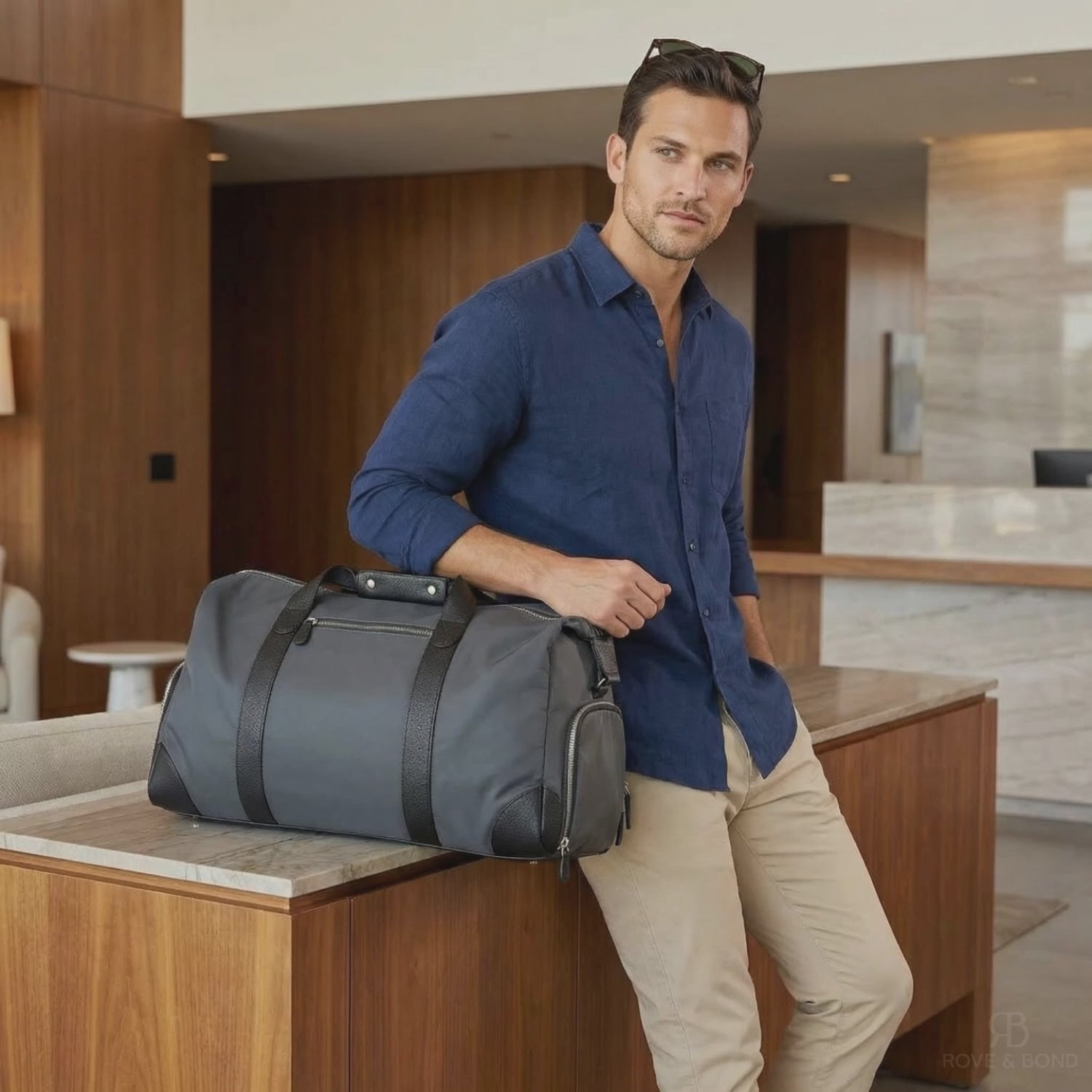 mens luxury travel bag in hotel charcoal black grey