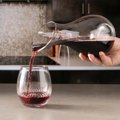 Red wine from reims slant wine decanter being poured into an avignon glass