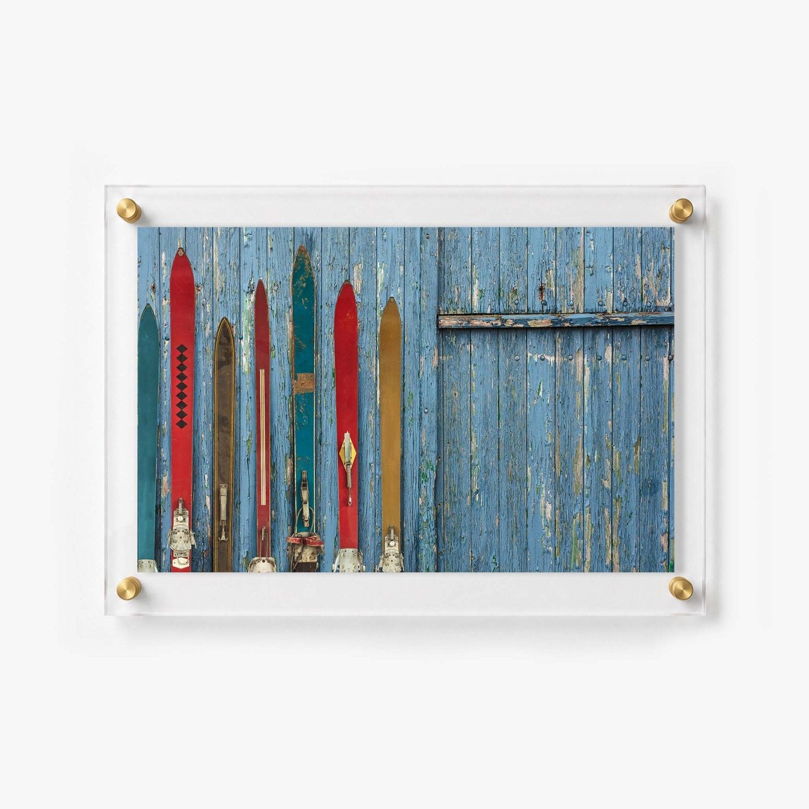 Vintage ski still life displayed in a modern clear acrylic wall mount
